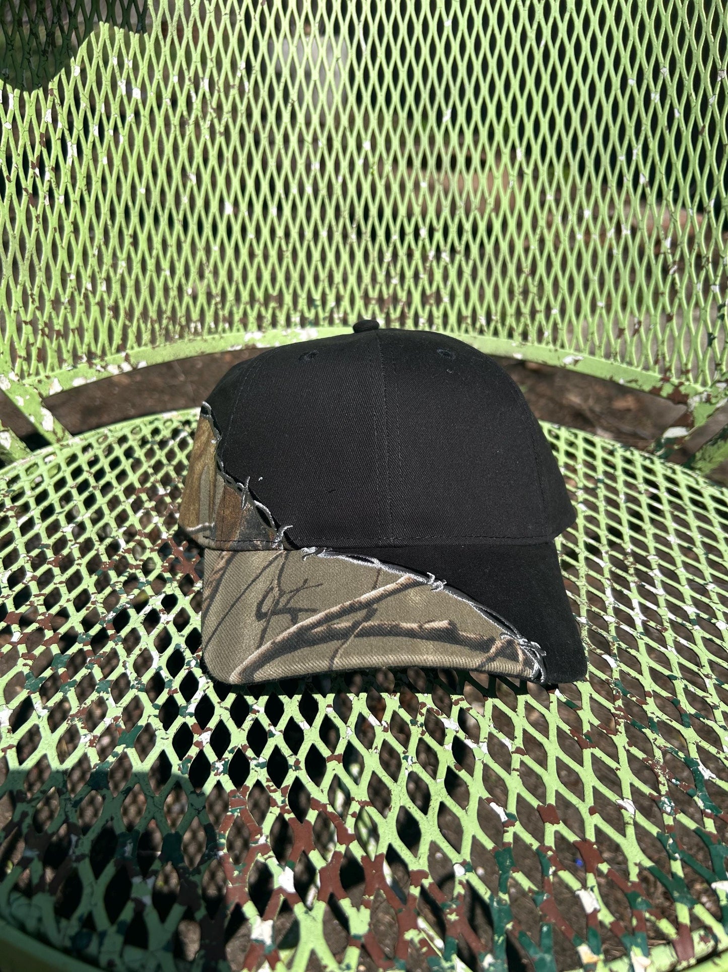 Custom embroidered barb wire camo trucker hat