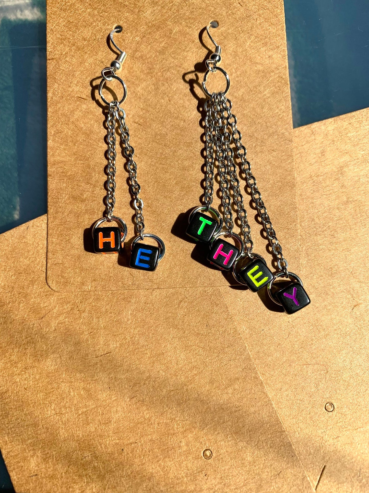 Subtle edgy pronoun earrings!