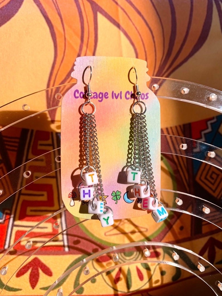 Subtle edgy pronoun earrings!