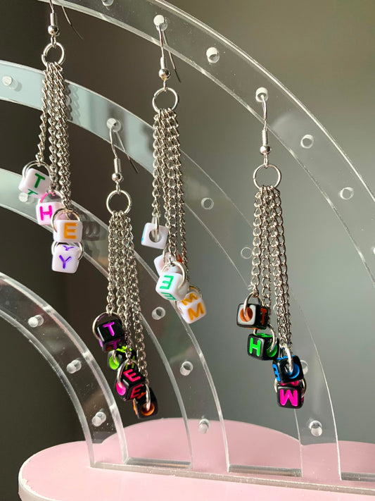 Subtle edgy pronoun earrings!