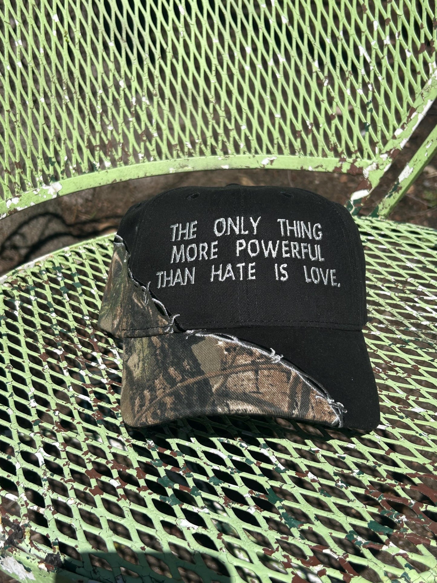 Custom embroidered barb wire camo trucker hat