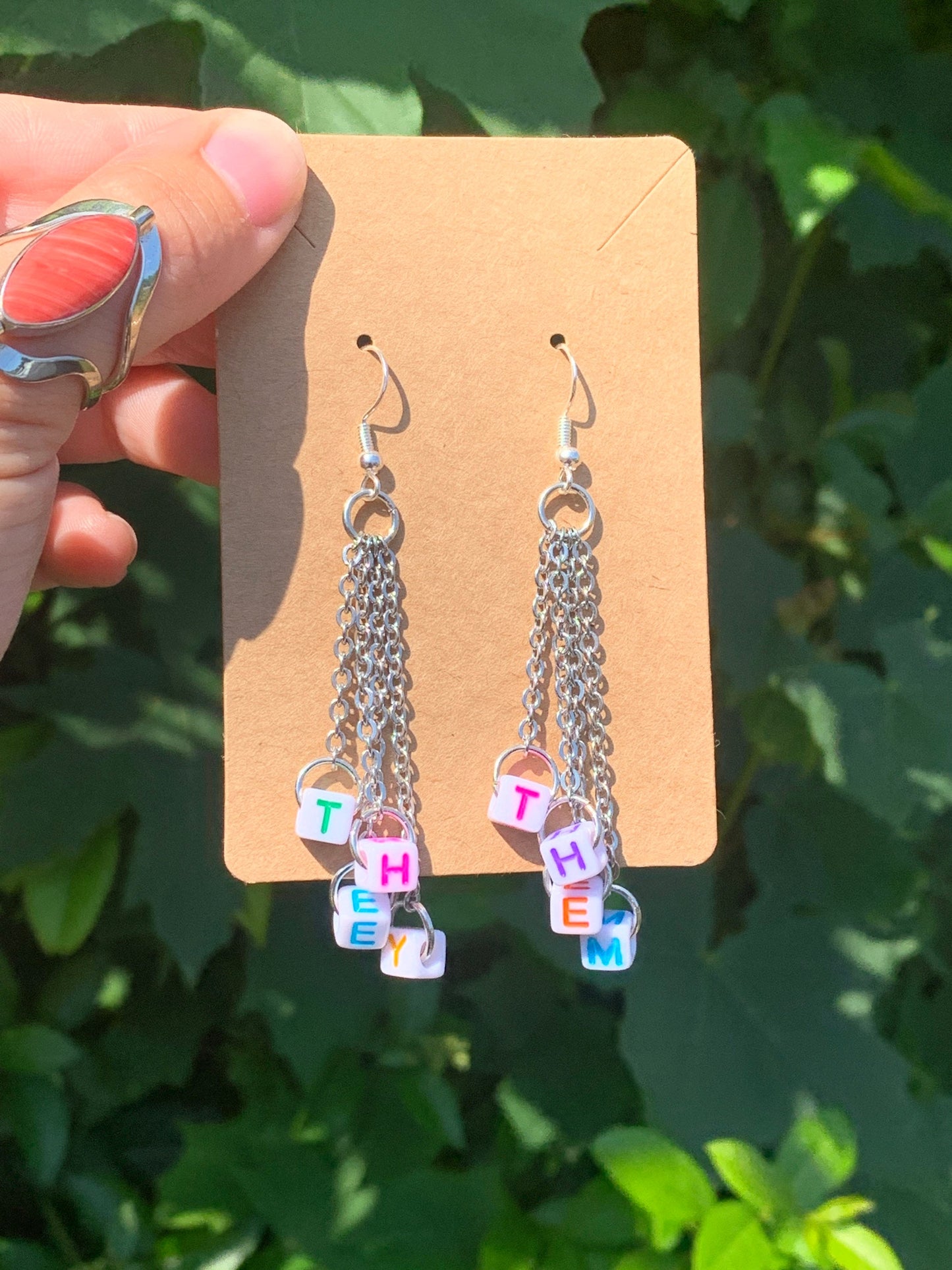 Subtle edgy pronoun earrings
