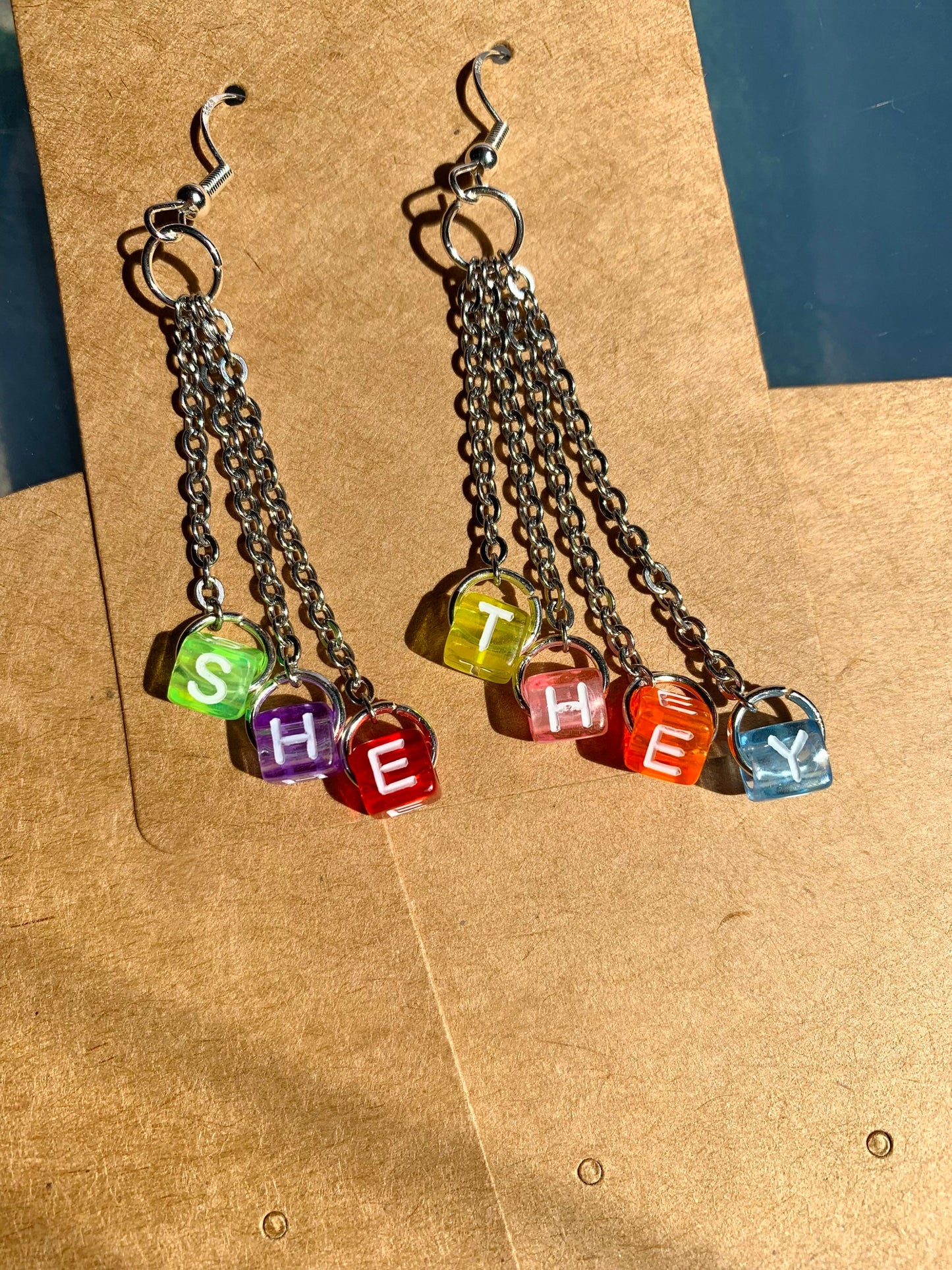 Subtle edgy pronoun earrings