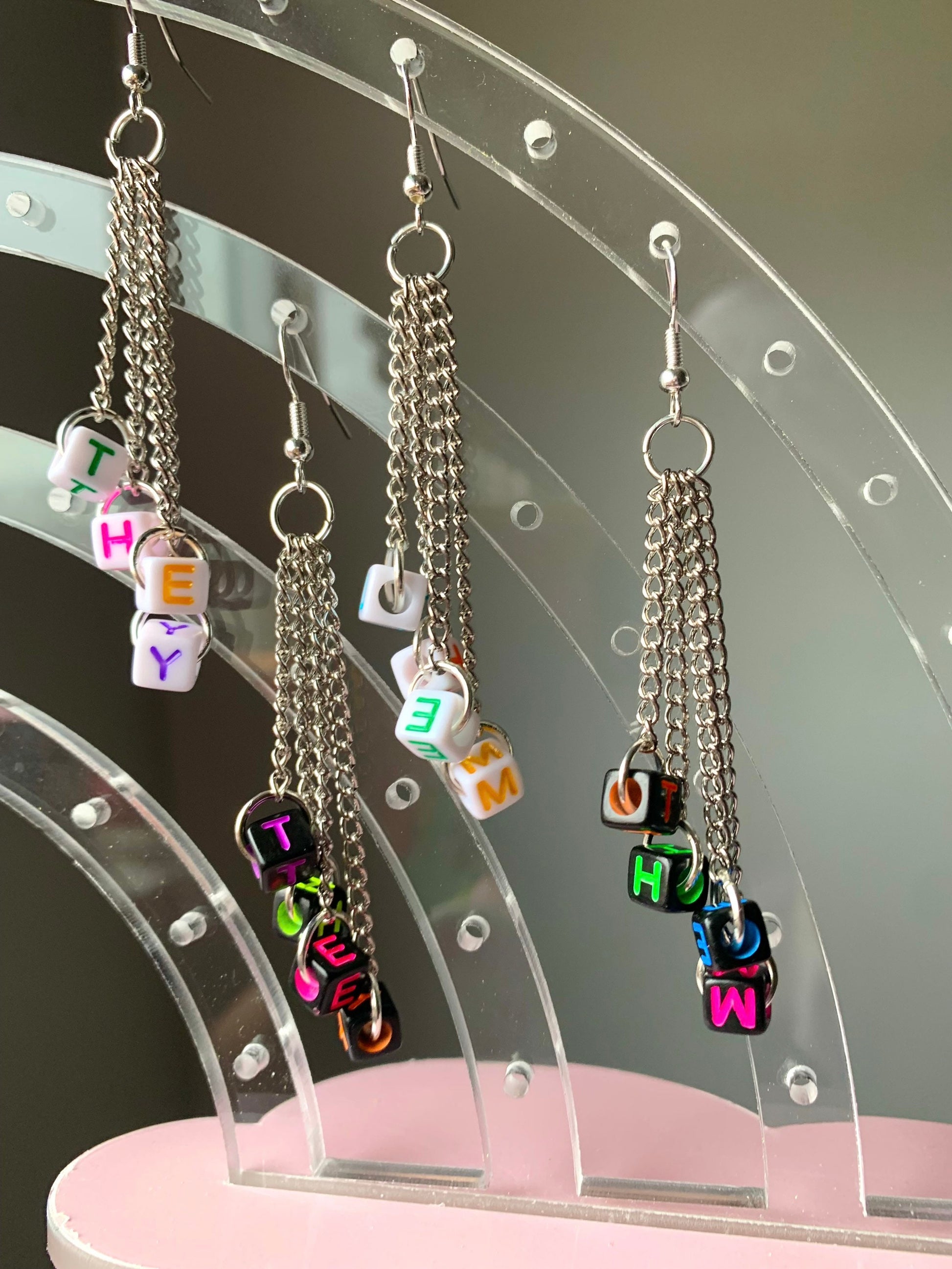 Subtle edgy pronoun earrings