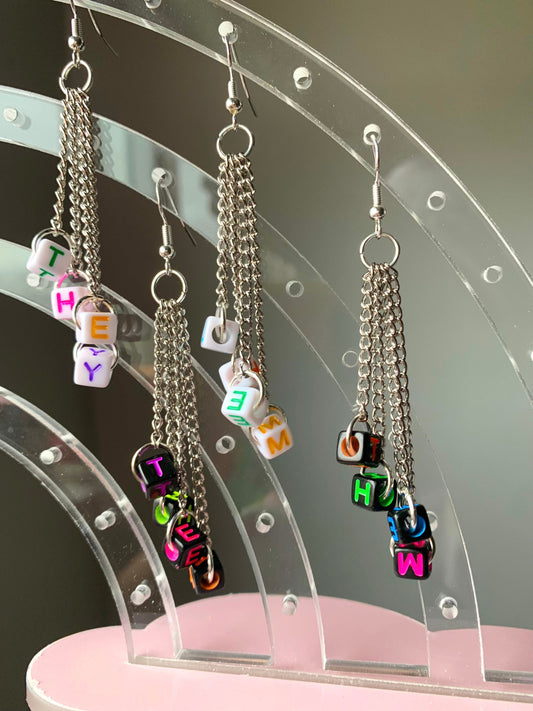 Subtle edgy pronoun earrings